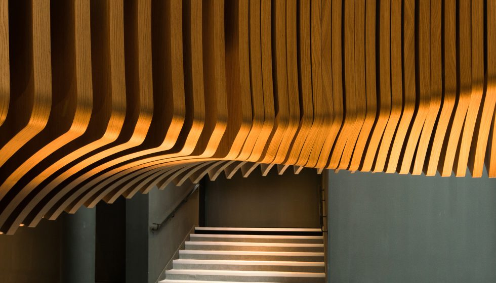 Ora Ïto uses hundreds of wooden slats for snaking stairs at LVMH offices