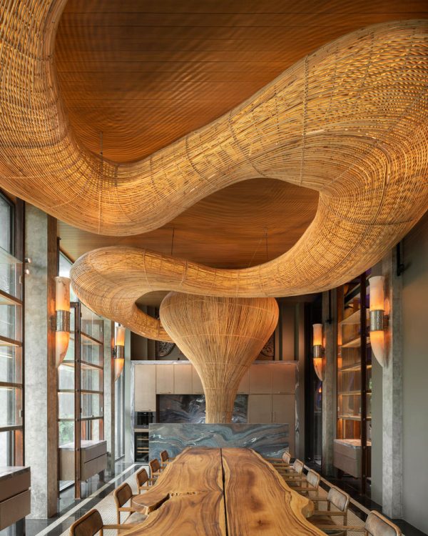 Rattan installation's natural forms in gallery composition
