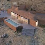 BASE Studio employs wood and natural fibers to create an earthquake-resistant 'Quincha' House