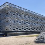 Texoversum features a textile-like facade made of carbon fibres wound by robots