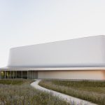 La Chesnaie Gymnasium looks like a metallic sculpture with a mostly closed facade