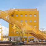 MVRDV transforms the new hub of Atelier Gardens Berlin with a grand yellow staircase