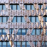 Manuelle Gautrand designs an office building with a folded glass facade, resembling Japanese origami