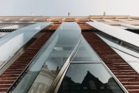 UNStudio shapes The Looking Glass with bricks, glass, and flowing curves