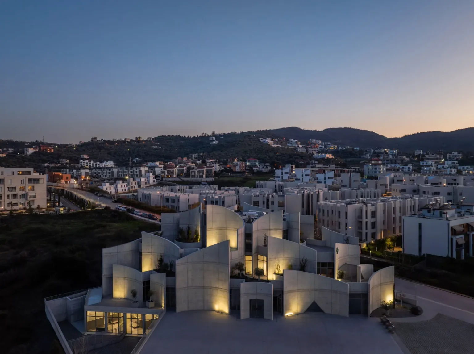 Curved Concrete Vet Hospital in Tirana by Davide Macullo Architects