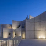 Curved Concrete Vet Hospital in Tirana by Davide Macullo Architects