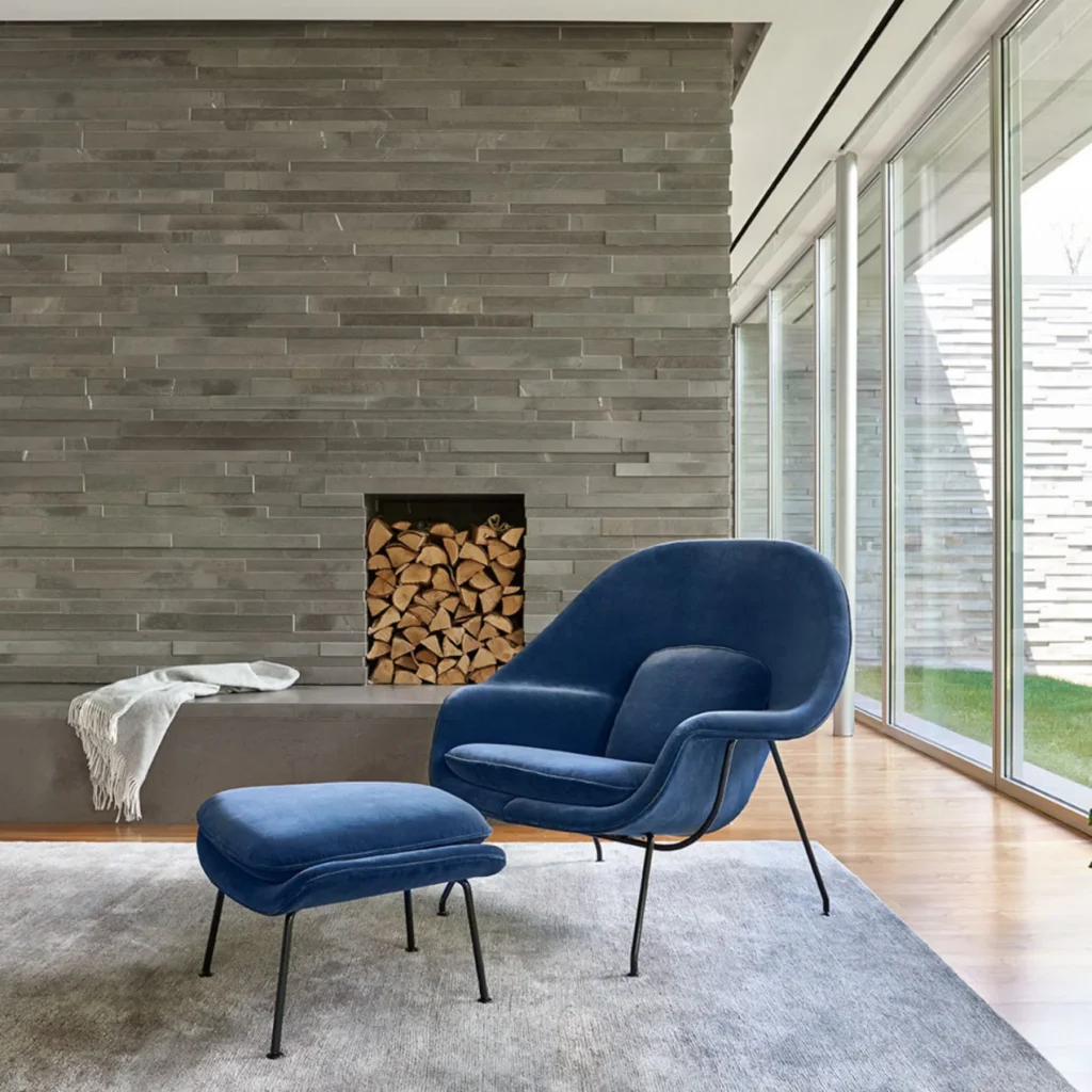 Googie’s Superhero Makeover: Retro-Futurism in Marvel’s ‘Fantastic Four: First Steps’ 17 Saarinen Womb Chair in blue © PALETTE & PARLOR