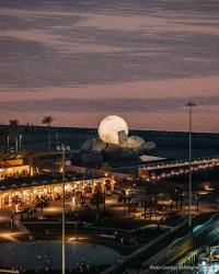 KAWS’s 32-Meter Companion Raises a Glowing Moon in Abu Dhabi