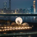 KAWS’s 32-Meter Companion Raises a Glowing Moon in Abu Dhabi
