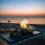 KAWS’s 32-Meter Companion Raises a Glowing Moon in Abu Dhabi