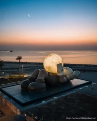 KAWS’s 32-Meter Companion Raises a Glowing Moon in Abu Dhabi