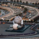 KAWS’s 32-Meter Companion Raises a Glowing Moon in Abu Dhabi