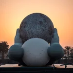 KAWS’s 32-Meter Companion Raises a Glowing Moon in Abu Dhabi