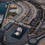 KAWS’s 32-Meter Companion Raises a Glowing Moon in Abu Dhabi