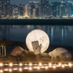 KAWS’s 32-Meter Companion Raises a Glowing Moon in Abu Dhabi