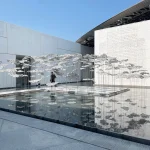 YOKOMAE et BOUAYAD’s stainless-steel pavilion at Louvre Abu Dhabi