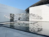 YOKOMAE et BOUAYAD’s stainless-steel pavilion at Louvre Abu Dhabi
