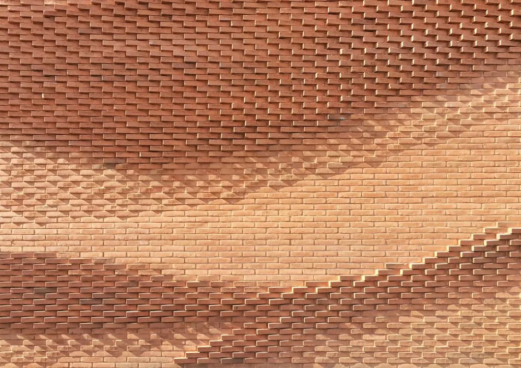 Rewriting Brick in Contemporary Architecture with Geometry, Craft, and Climate Intelligence