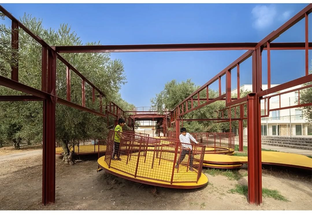ZAV Architects’ Bright Red and Yellow Playground Cuts Through Iran’s Olive Groves 7 Cheshm Cheran Bazi Playground by ZAV Architects