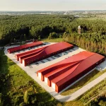 Aranchii Architects Designs a Modular Logistics Hub with Red Sculptural Roofs