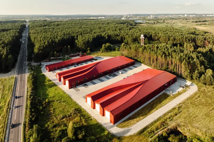 Aranchii Architects Designs a Modular Logistics Hub with Red Sculptural Roofs