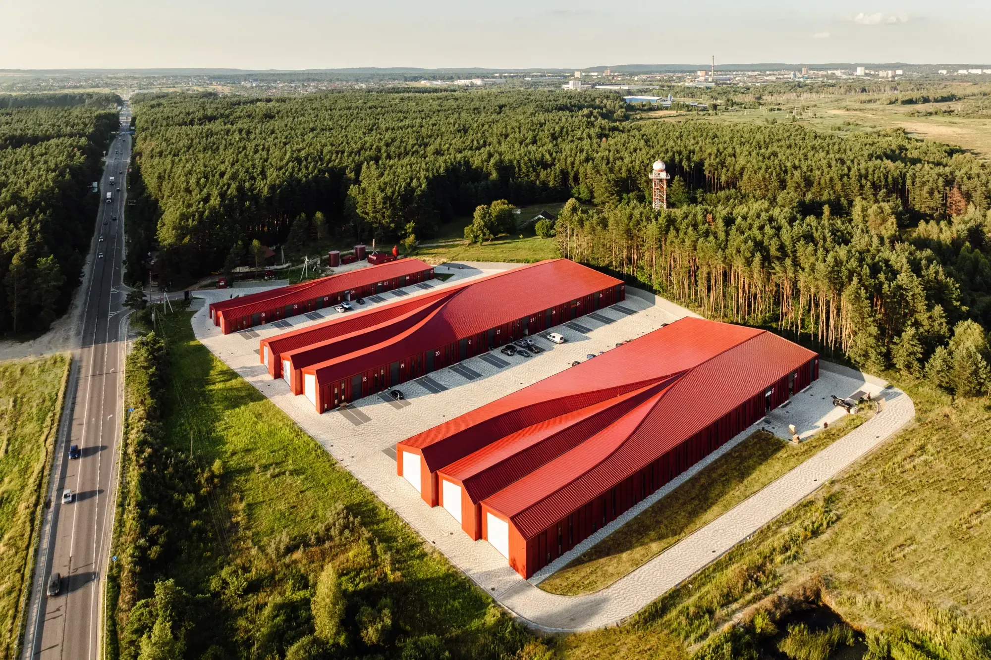 Aranchii Architects Designs a Modular Logistics Hub with Red Sculptural Roofs