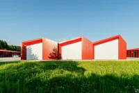 Aranchii Architects Designs a Modular Logistics Hub with Red Sculptural Roofs