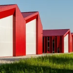 Aranchii Architects Designs a Modular Logistics Hub with Red Sculptural Roofs
