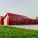 Aranchii Architects Designs a Modular Logistics Hub with Red Sculptural Roofs