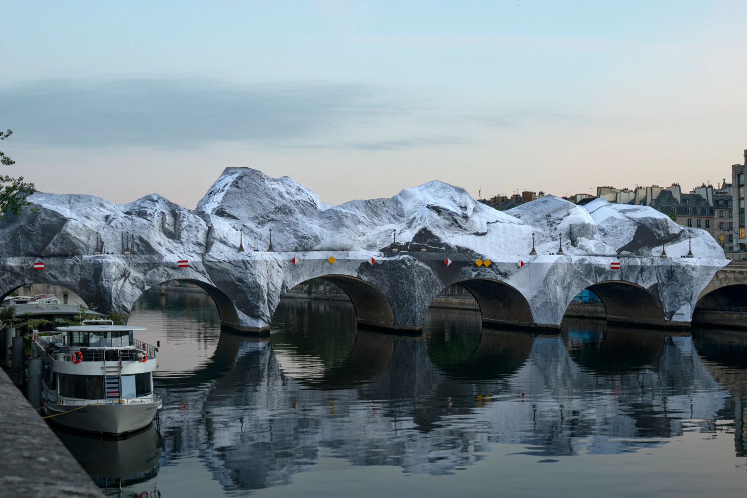 Street Artist JR Transforms Paris’ Pont Neuf Into Monumental Inflatable Cave