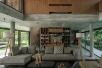 Twin Banyan Trees Define Anonym’s Baan Saikhoo Residence in Thailand