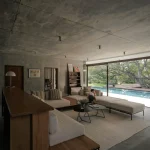 Twin Banyan Trees Define Anonym’s Baan Saikhoo Residence in Thailand