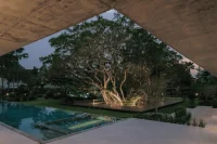 Twin Banyan Trees Define Anonym’s Baan Saikhoo Residence in Thailand