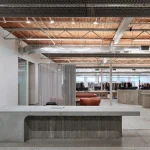 Purple Brand Studios by Scott & Scott Architects Blend Industrial Heritage with Raw Concrete Interventions