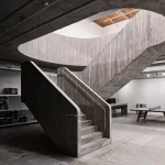 Purple Brand Studios by Scott & Scott Architects Blend Industrial Heritage with Raw Concrete Interventions