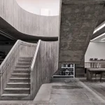 Purple Brand Studios by Scott & Scott Architects Blend Industrial Heritage with Raw Concrete Interventions