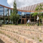 BIG Designs Dymak’s Circular Headquarters as a Living Showcase of Sustainable Materials