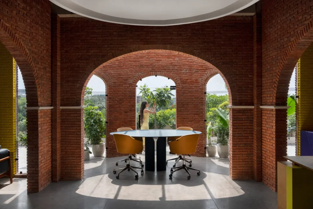 Logic Design + Build Transforms an Existing Office with Brick Arches and Mondrian-Inspired Interiors
