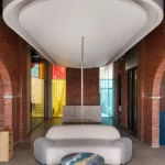 Logic Design + Build Reinvents an Office with Brick Arches and Mondrian-Inspired Interiors