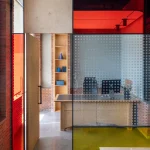 Logic Design + Build Reinvents an Office with Brick Arches and Mondrian-Inspired Interiors