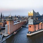 Explore how adaptive reuse can transform heritage buildings into sustainable urban assets while supporting conservation, housing, economic regeneration, climate goals, and social resilience.
