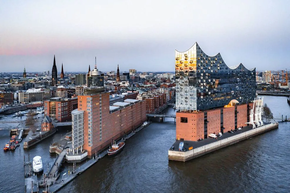 Explore how adaptive reuse can transform heritage buildings into sustainable urban assets while supporting conservation, housing, economic regeneration, climate goals, and social resilience.