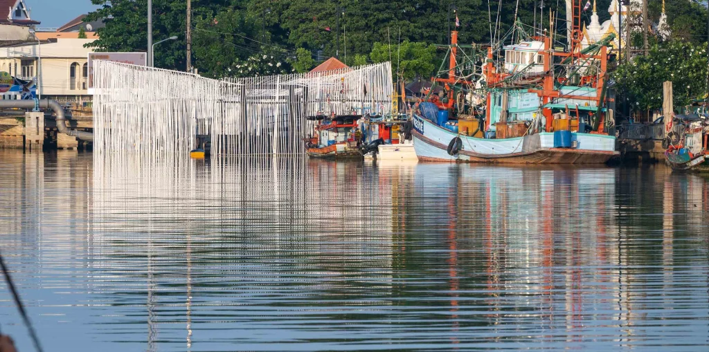 Pattani Fishermen Community Hub beside fishing boats
