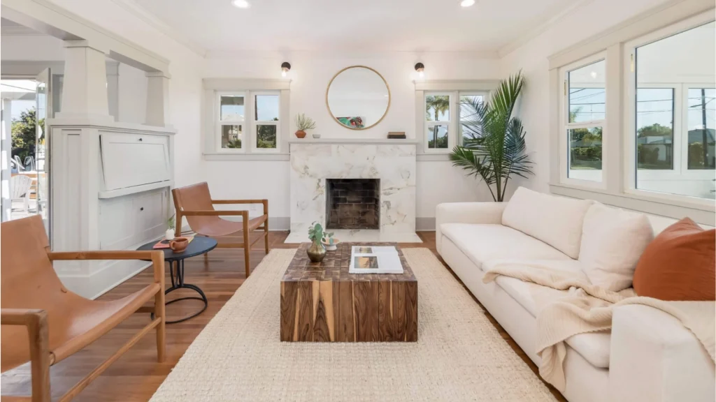 Restored living room with marble fireplace - North Park Craftsman renovation