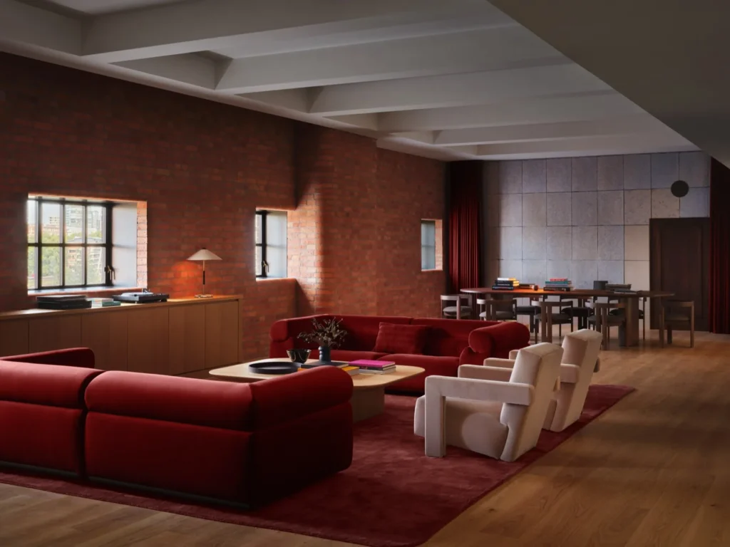 Lounge or green-room area with red seating and soft lighting