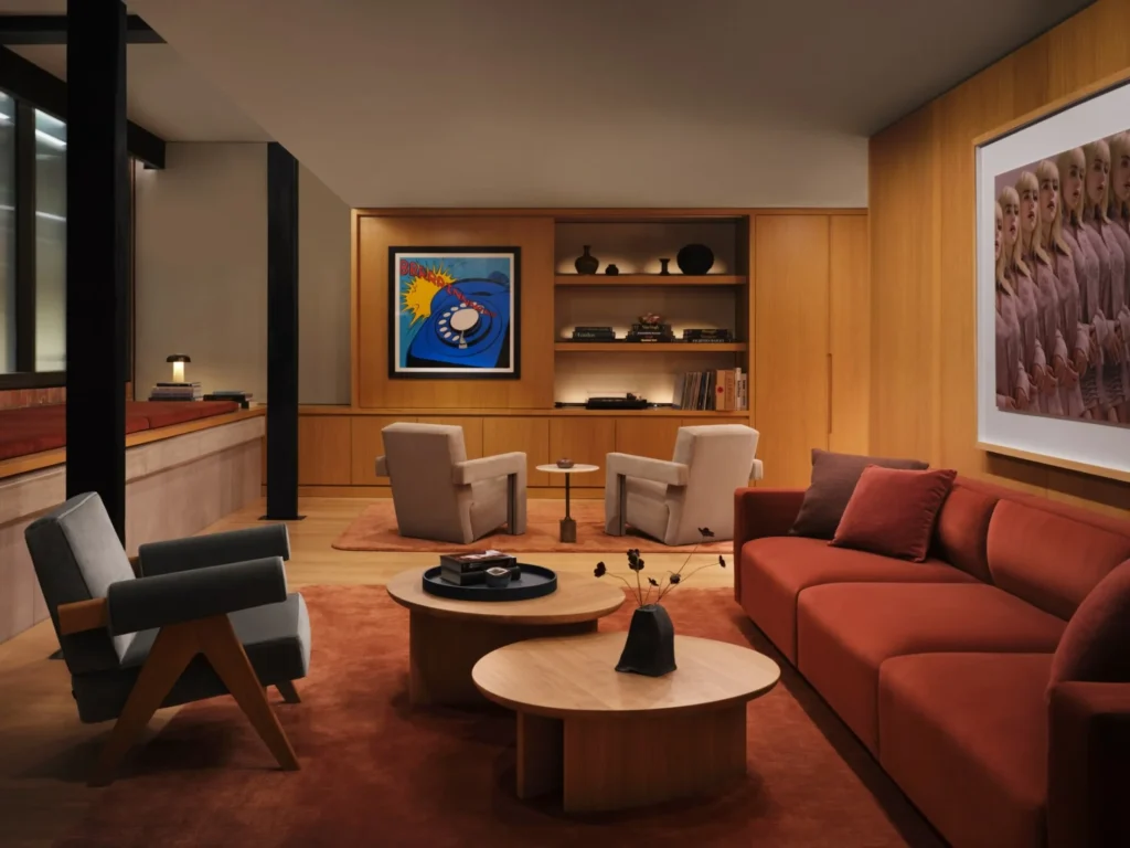 Comfortable seating area with sofas, tables and warm wood tones