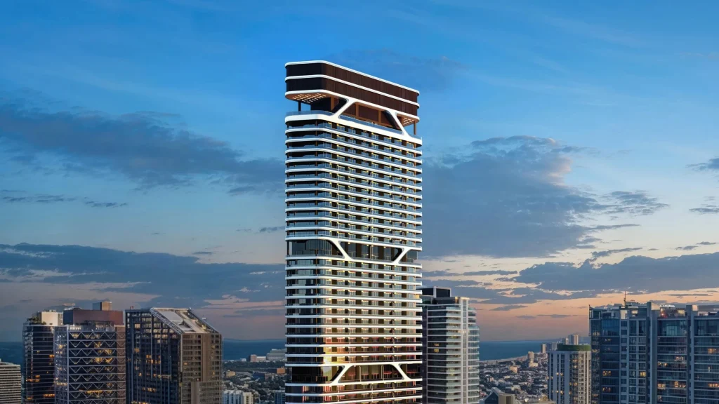 Close exterior detail of the upper volumes and façade of Bugatti Residences Miami