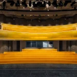 Stage and auditorium of the Opera House with golden proscenium and tiered seating