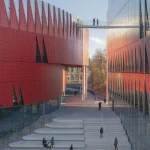 Close-up of the red aluminium facade with triangular panels and integrated lighting