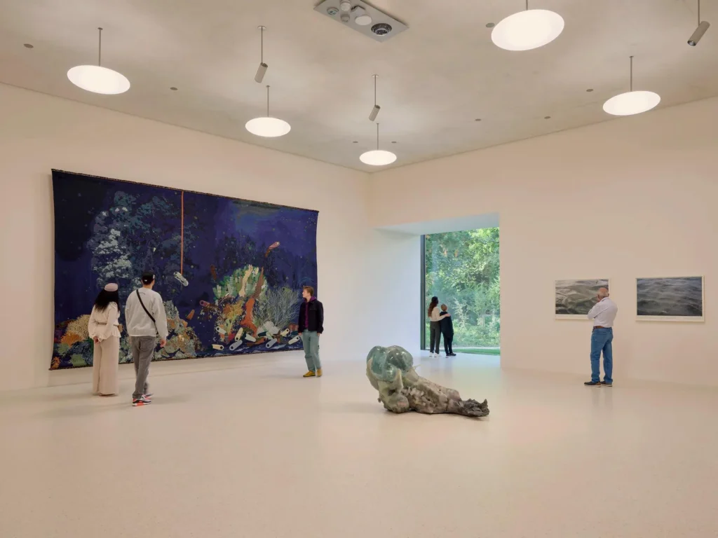 Interior gallery of the Wyss Museum with visitors viewing large artworks